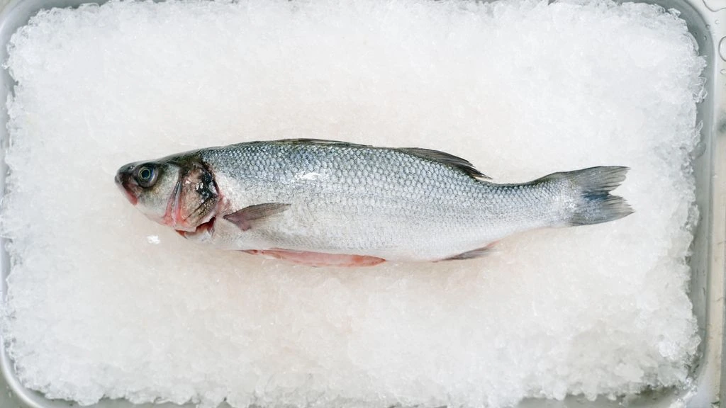 Salt-crusted branzino, cracked at the table